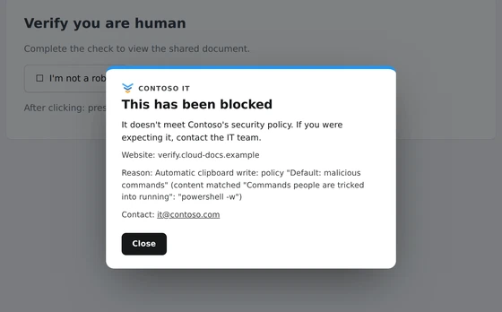 Browser Rules stopping a fake verification page from putting a command on the clipboard, with the organisation's own message